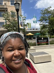 Photo of Ashley Whitaker in front of Memorial Union