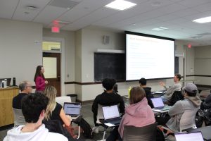Presenter talking to students at the RISE event