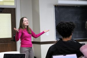 Presenter talking to students at the RISE event
