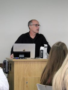 Presenter talking to students at the RISE event