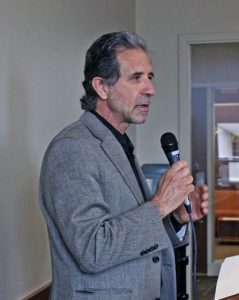 Alberto speaking with a microphone