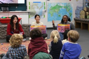 Reading a story to children at CISH